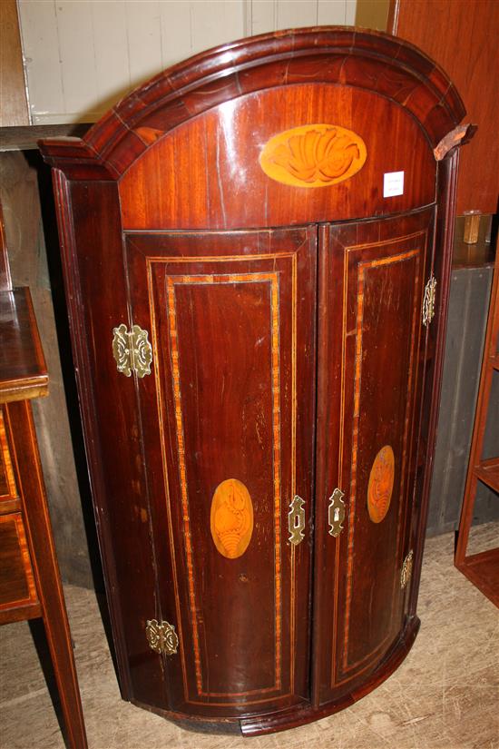George III mahogany and shell inlaid bow front corner cupboard